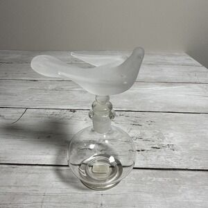 Faroy frosted glass perfume bottle with a stylized bird finial.